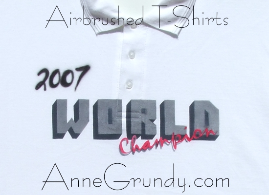 World Champion airbrushed textile ink lettering on a polo shirt annegrundy.com